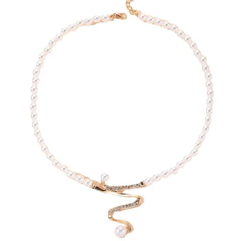 Fashion Personality Deep V Clavicle Pearl Pendant Suit - 0 - CJ