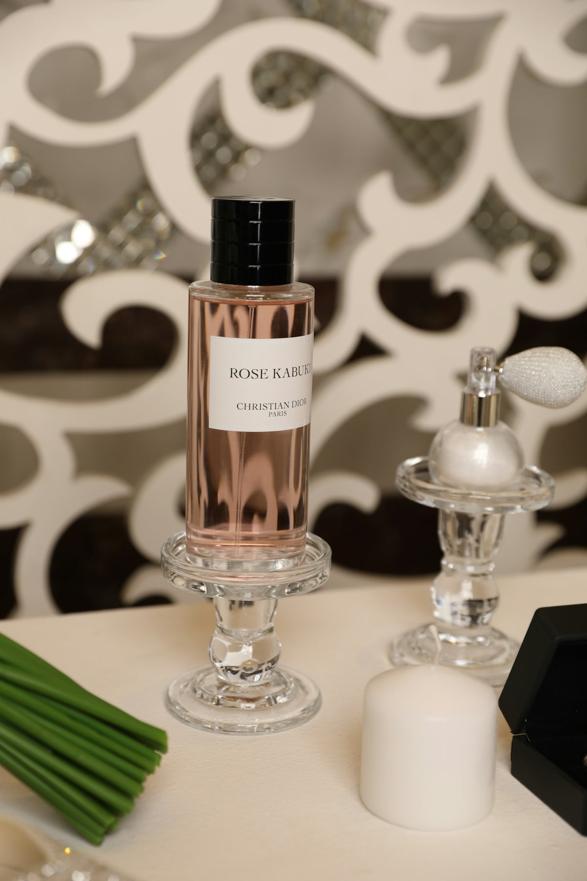 Rose kabuki perfume is showcased in an elegant display.